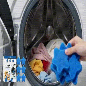 Close-up view of blue star-shaped pet hair remover sponges being used in a washing machine