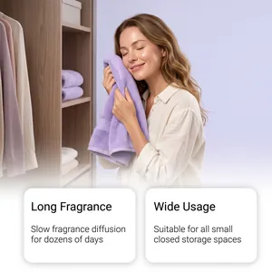 Caucasian woman smelling a fresh towel, showing the long-lasting effect of scented sachets