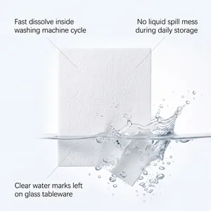 Close-up of a white dishwasher cleaning tablet dissolving in water with splashes.