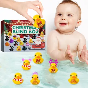 Detailed shot of Christmas rubber duck advent calendar toys floating in a baby's bath