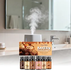 Detailed macro view showing a set of six bakery-inspired fragrance oils with a misting diffuser