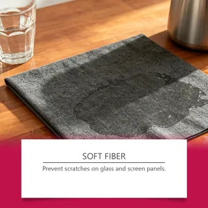Close-up showing the absorbent soft fiber cleaning cloth on a wooden surface.