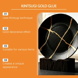Gold kintsugi glue for ceramic repair showing decorative gold effect on a black plate