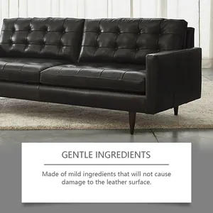 Close-up of black leather sofa showing the effects of mild furniture care cream