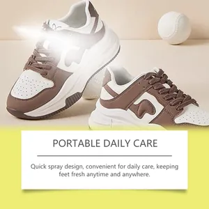 Macro view of stylish brown and white sneakers showcasing portable daily care spray effects.
