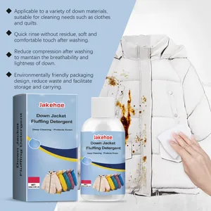 Detail view of down jacket fluffing detergent removing brown stains from a white coat