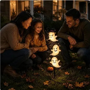 Solar Halloween ghost garden stake light with glowing ghosts in family garden scene