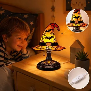 Detail view of Halloween witch hat table lamp with stained glass pattern and switch