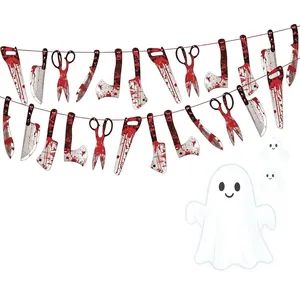 Close-up of blood-splattered paper weapons and ghost Halloween party banner