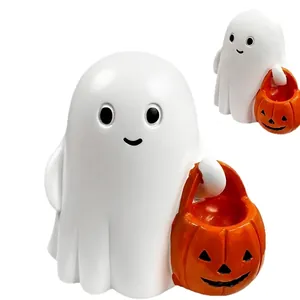 Figurine de fantôme blanc Halloween tenant un panier de citrouille orange sculpté