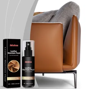 Close-up of Jakehoe leather maintain fluid bottle with a premium leather sofa background