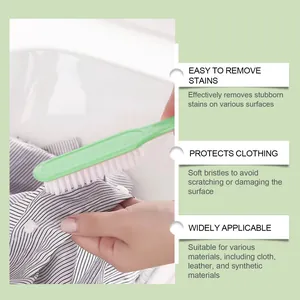 Close-up of soft-bristled cleaning brush effectively removing stains from clothing fabric