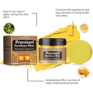 Detail view of premium furniture beeswax with application sponge and tea tree oil.