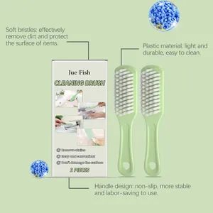 Detail showing 2-piece soft bristle cleaning brush set with ergonomic green handles.