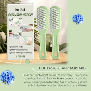 Two multipurpose soft cleaning brushes with Jue Fish packaging for home and travel.