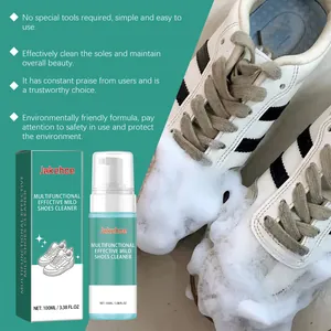 Macro view of active foam cleaning white sneakers using multifunctional shoe cleaner