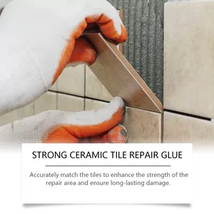 Strong ceramic tile repair glue being applied to fix a wall tile by a professional gloved hand