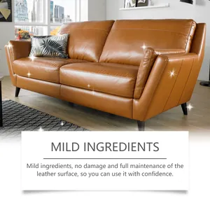 Detailed macro view showing the glossy finish of a brown leather sofa after maintenance