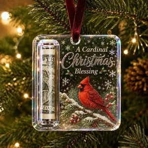 Detailed shot of clear acrylic Christmas money holder with cardinal bird and ribbon.
