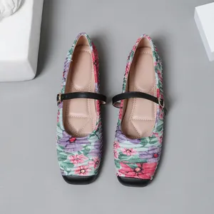 Close-up of vintage floral Mary Jane ballet flats with pleated fabric and square toe