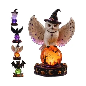 Colección de bolas de cristal de Halloween con cuervos, búhos y diseños espeluznantes.
