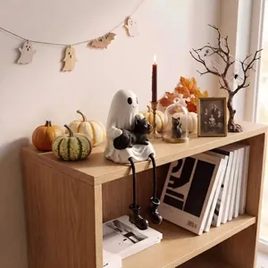Detailed Spooky Halloween ghost figurine holding a small black cat on a wooden shelf