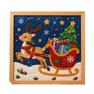 Handcrafted Christmas fabric art painting featuring reindeer and sleigh in wooden frame