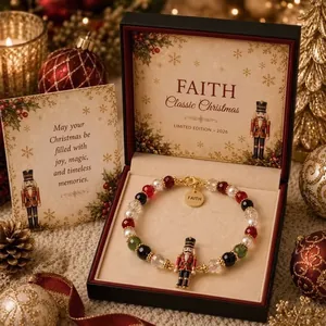 Detailed view of nutcracker charm on a festive Christmas beaded bracelet in a gift box