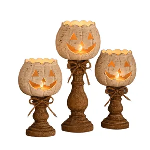 Set aus drei Vintage-Kürbis-Kerzenhaltern mit geschnitzten Gesichtern für Halloween