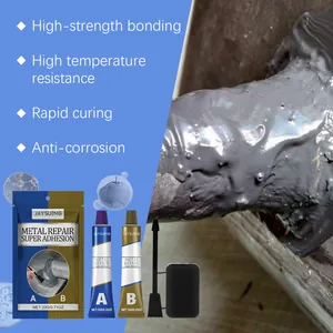 Detail view of high-strength metal repair AB glue applied to a leaking pipe with applicator