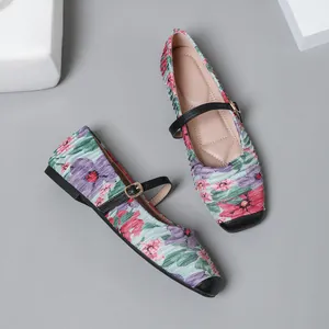 Top-down detail of French retro floral Mary Jane ballet flats with pleated fabric texture.