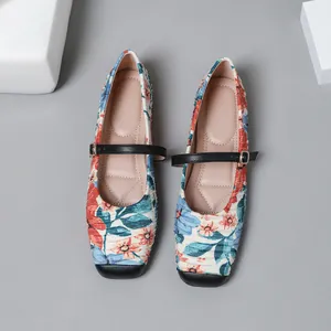 Close-up detail of vintage floral Mary Jane ballet flats with square toe design
