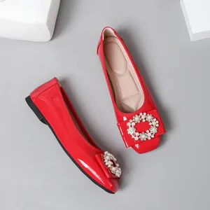 Red patent leather ballet flats with elegant pearl and rhinestone buckle decoration