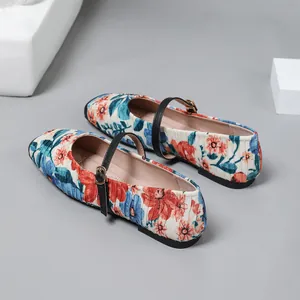 Detailed rear view of vintage floral print Mary Jane flats with elegant black straps