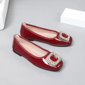 Elegant red patent leather square toe flat shoes with sparkling rhinestone buckle detail