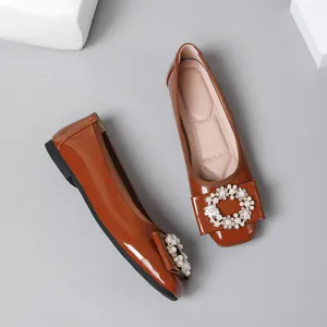 Brown patent leather ballet flats with elegant pearl and rhinestone buckle decoration