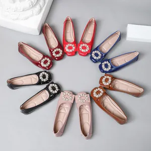 Assorted women's ballet flats in multiple colors featuring elegant pearl buckles