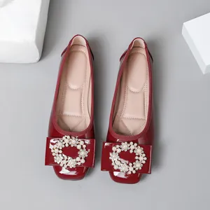 Elegant red patent leather ballet flats with square toe and pearl buckle decoration