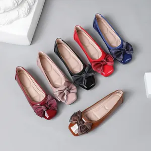 Elegant collection of women's glossy ballet flats with decorative bows in multiple colors