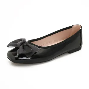 Elegant black patent leather ballet flats with a stylish bow detail for women's daily wear