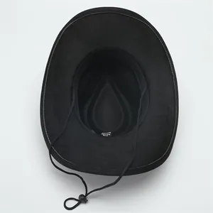Detailed interior view of a black wool cowboy hat showing the sweatband and chinstrap