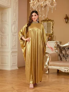 Elegant gold batwing sleeve dress with intricate rhinestone collar and loose silhouette