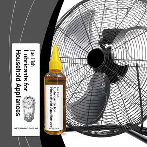 Bouteille et boîte de lubrifiant Jue Fish à côté d'un ventilateur industriel noir