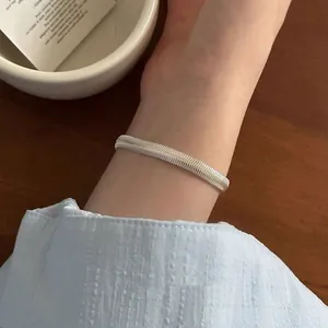 Elegant minimalist silver flat snake chain bracelet for women featuring Korean fashion style