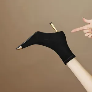 Elegant black sock boots with metallic square toe and gold stiletto heel for women.
