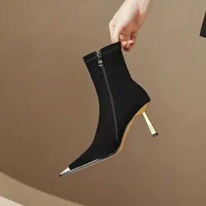 Elegant black stiletto ankle boots with metallic pointed toe and side zipper closure