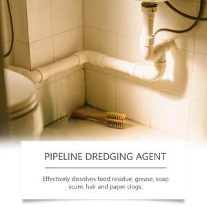 Detailed view of kitchen drainage pipes showing pipeline dredging agent application