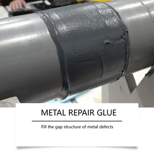 Detailed view of grey metal repair glue applied on a steel pipe for casting repair