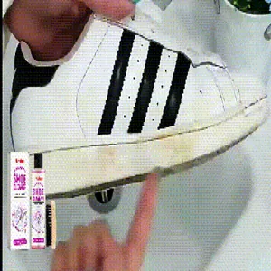 Close-up detail showing the powerful cleaning effect of JAKEHOE shoe cleaner on a white sneaker