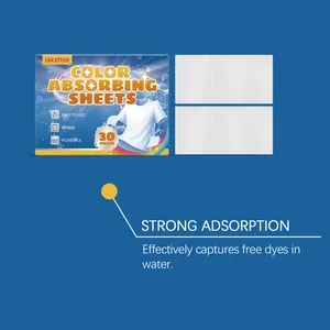 Detailed view of color absorbing sheets with packaging showing strong dye adsorption